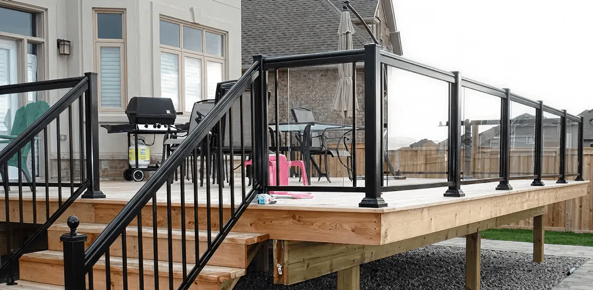 Handrail installation on a deck staircase for safety and code compliance in South Bend, IN